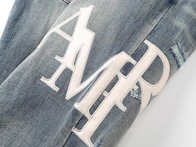 AMIRI Light Blue Distressed Appliqué Jeans